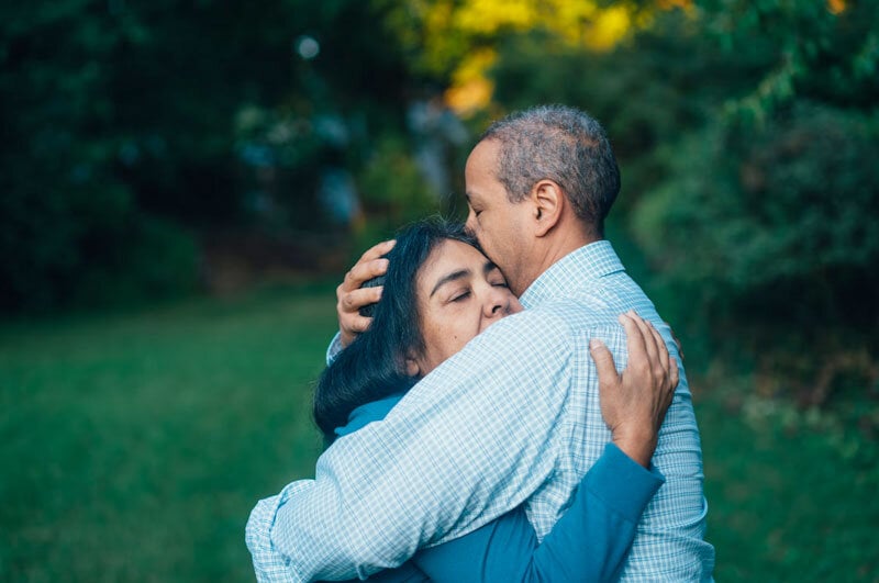 older man and woman embracing in anaheim cemetery