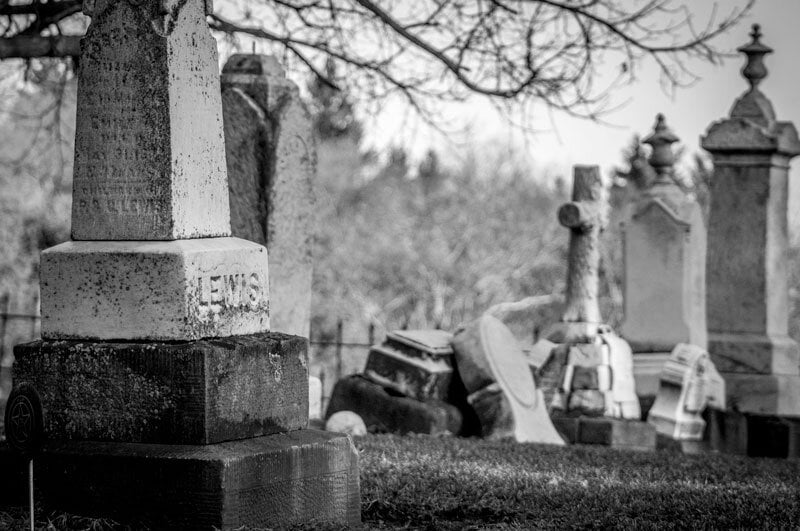 black and white photo of a cemetery and headstones in Hollywood Forever Cemetery