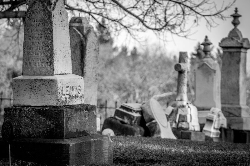 black and white photo of a cemetery and headstones in Hollywood Forever Cemetery