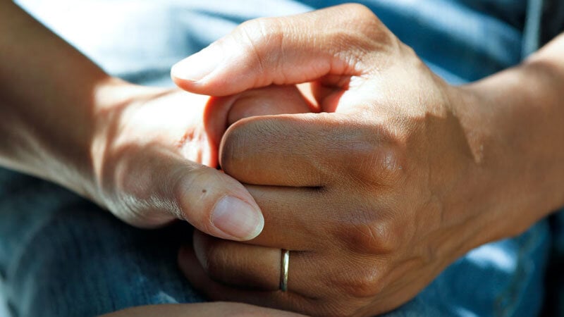 2 hands embracing at National Cancer Institute