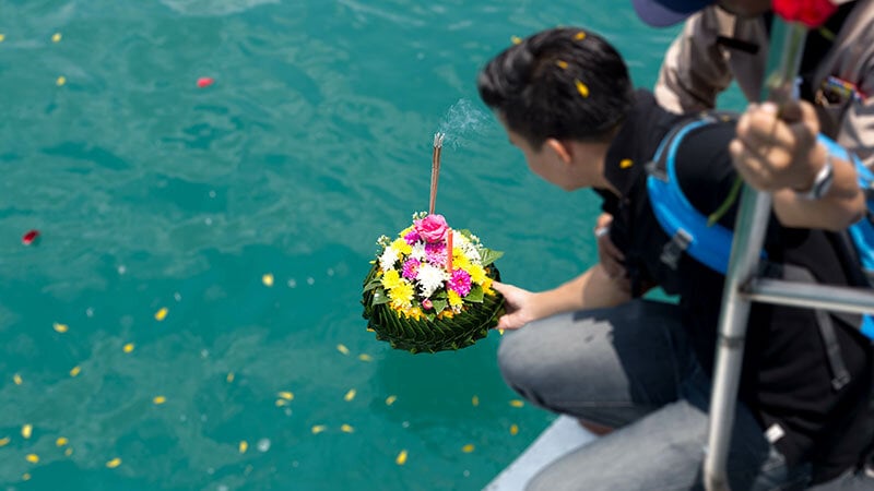 family placing loved ones ashes into Pacific ocean near Santa Barbara coast