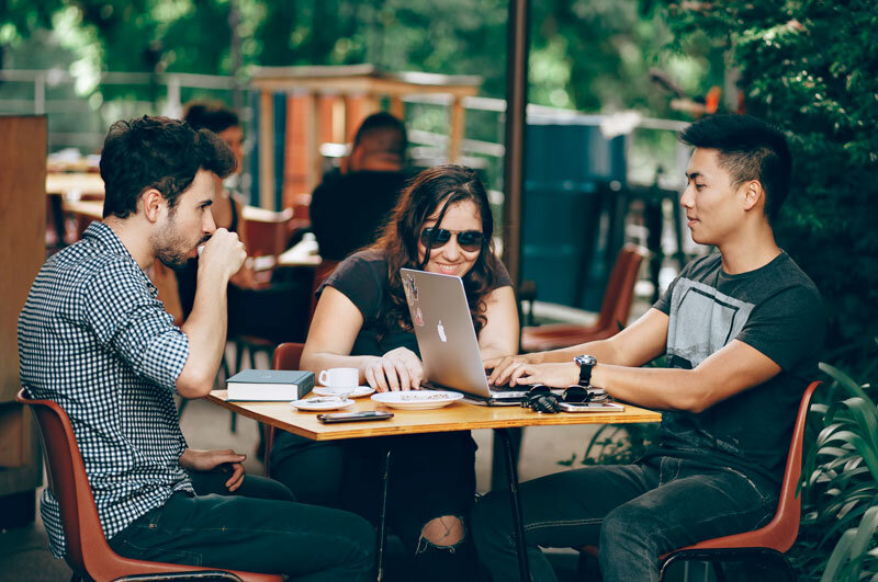 Millennials and Gen Xers using laptops to make online purchases