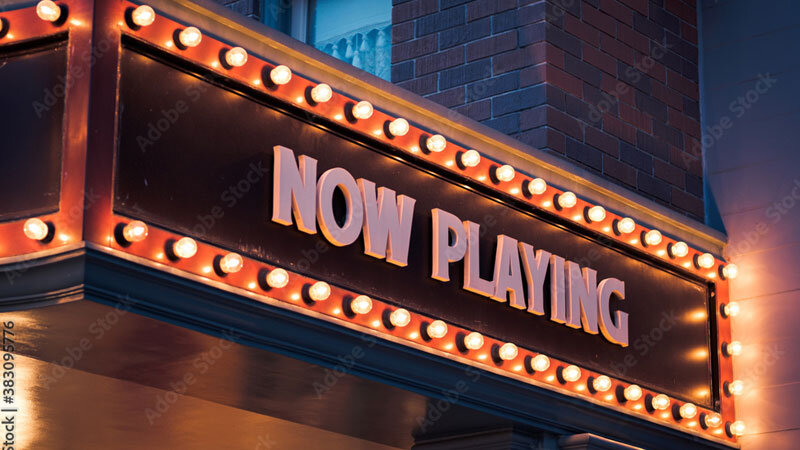 'now playing' movie marquee outside of anaheim theater