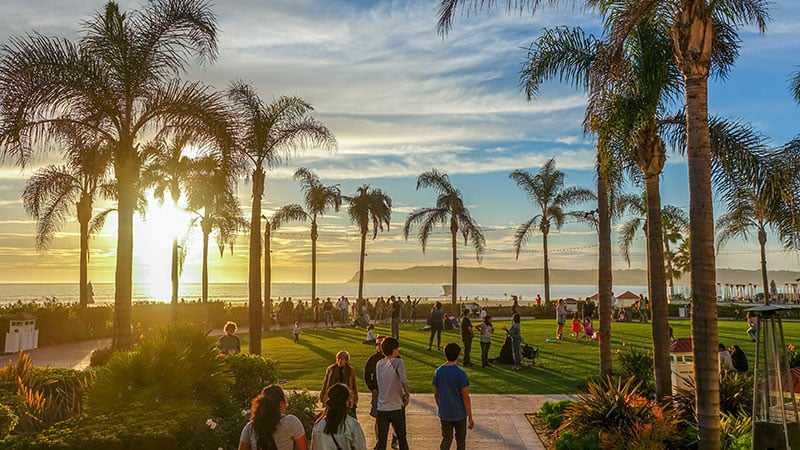 beach in san diego, with people holding celebration of life event