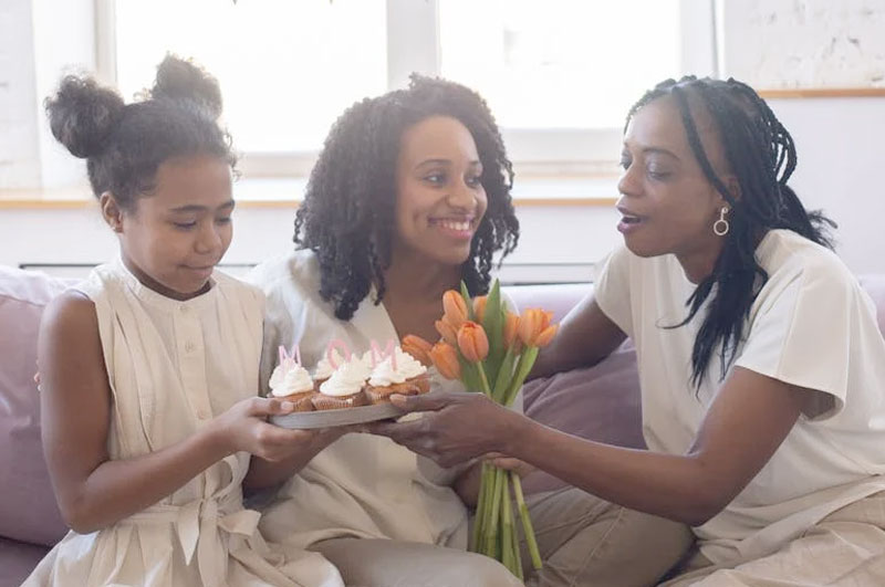 Mother and daughters together celebrating mother's day