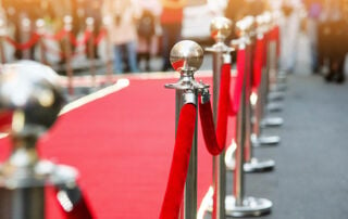 celebrity tribute event with red carpet and velvet ropes
