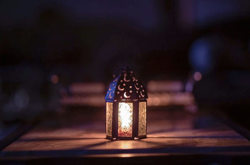 a memorial lantern lit at night