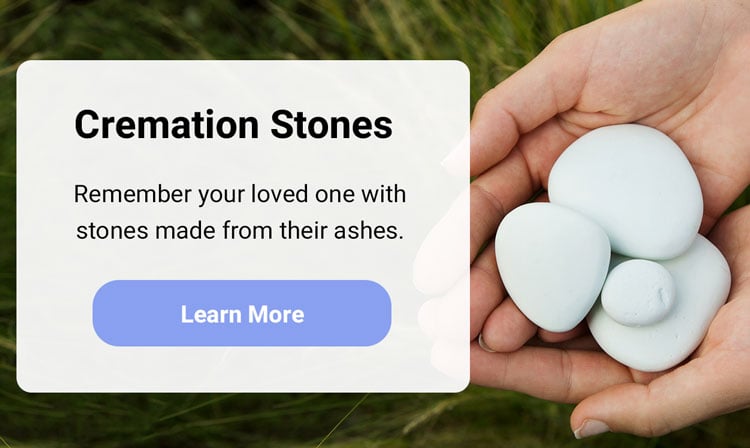 ad for cremation stones, hand holding stones made from ashes