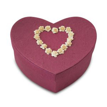 burgundy heart bio / biodegradable cremation urn with flower petals on top in shape of heart