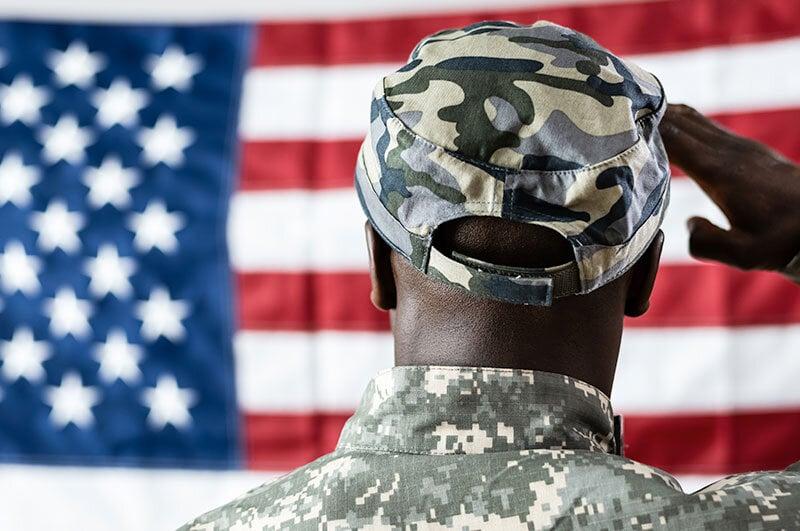 Soldier salutes flag, grateful for funeral benefits Orange County