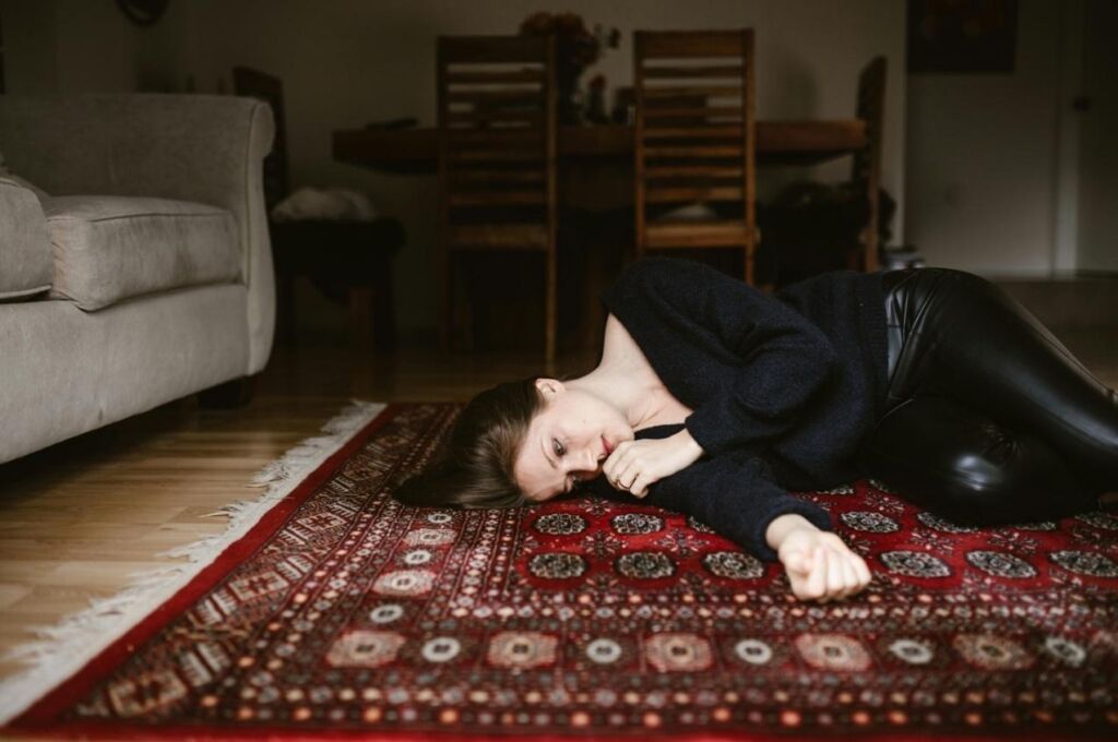 Woman in Los Angeles after a funeral service mourns over the loss of a loved one