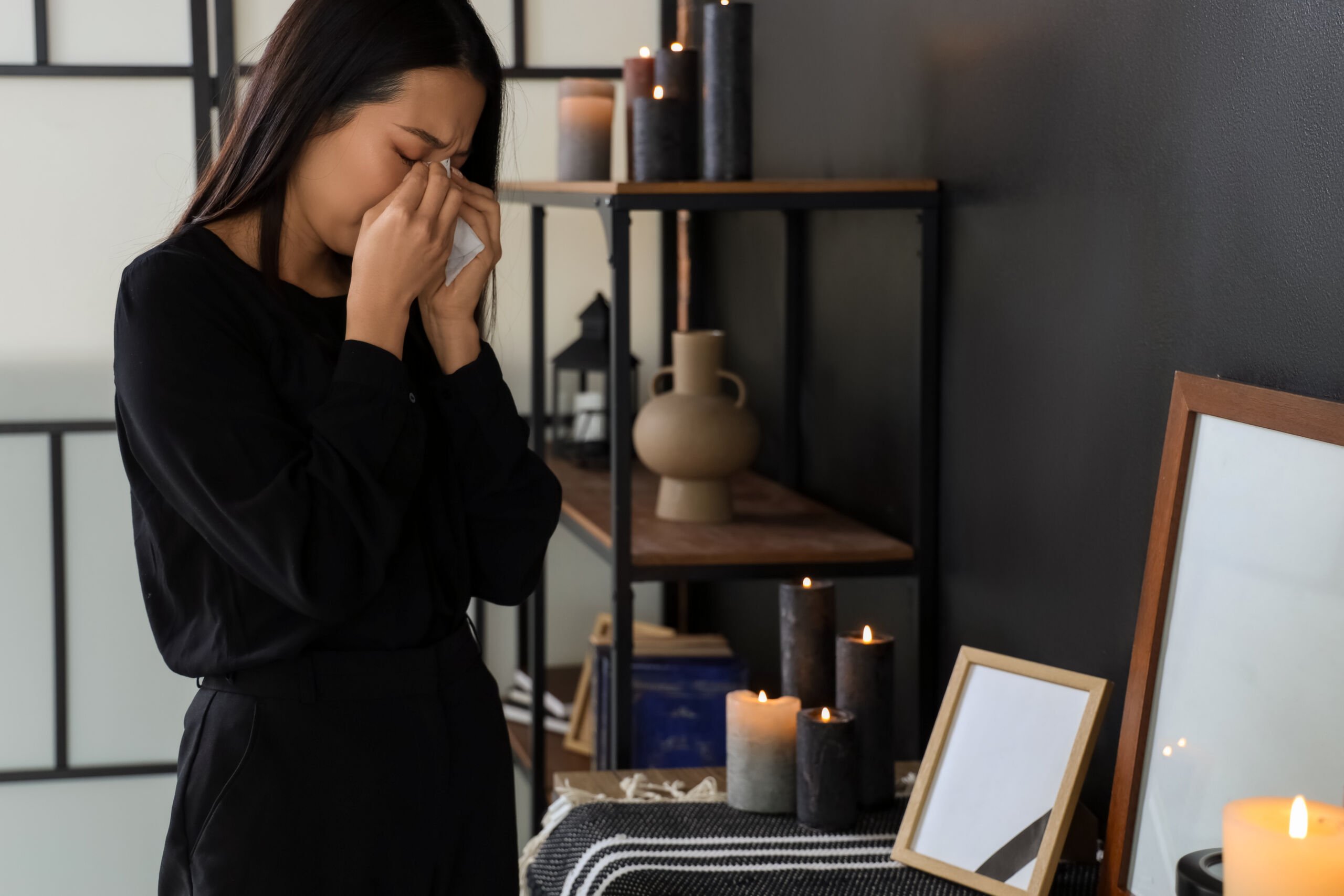 Woman mourns a loved one after death
