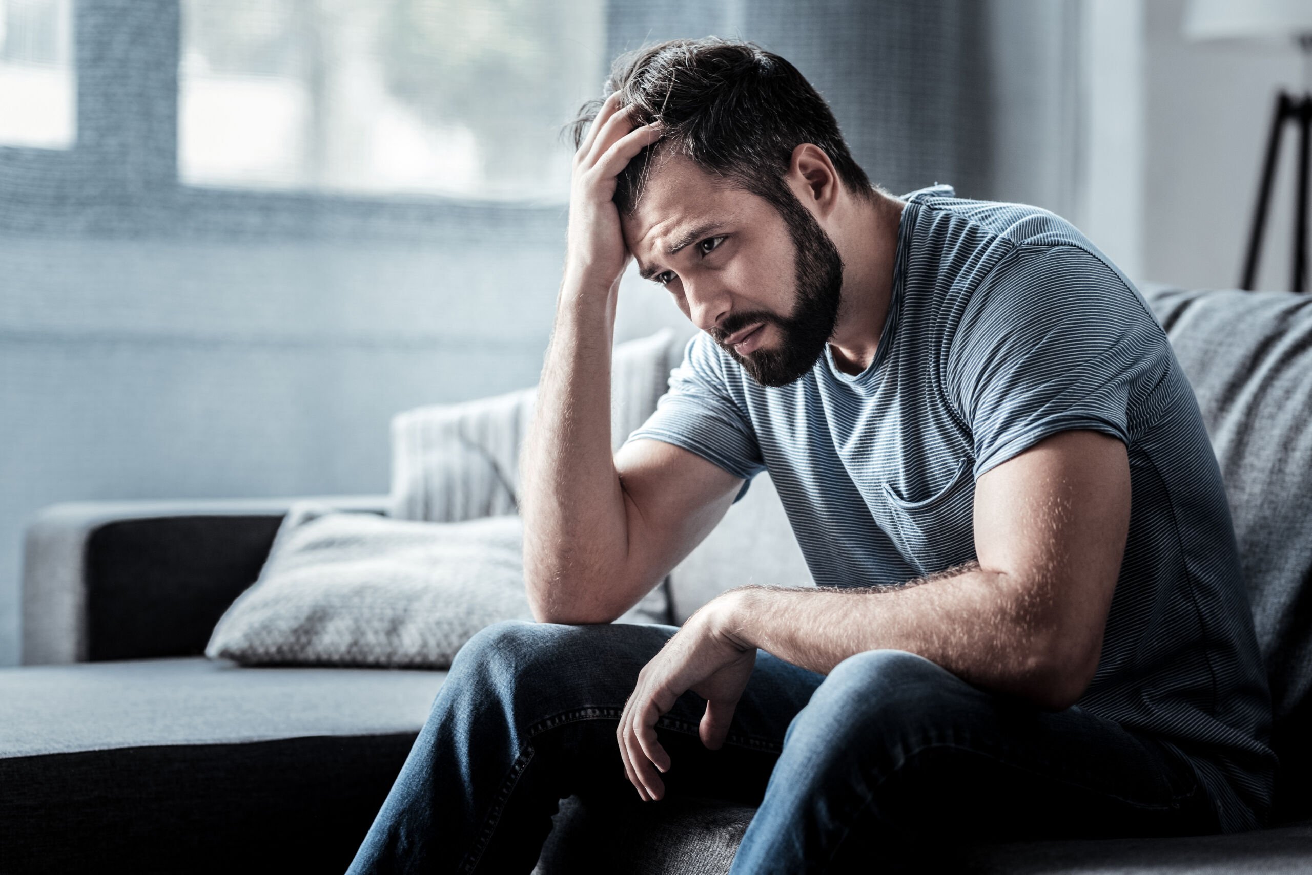 Man experiencing grief or depression