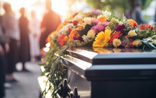 A funeral service with a coffin, flowers, and mourners in a church, symbolizing grief, remembrance, and the celebration of a life passed away.